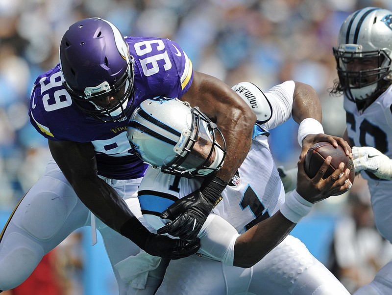 Carolina Panthers' Cam Newton (1) is sacked in the end zone for a safety by Minnesota Vikings' Danielle Hunter (99) in the first half of an NFL football game in Charlotte, N.C., Sunday, Sept. 25, 2016. 