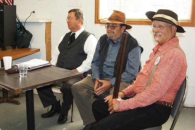 From left, Mike Boulware, Donnie Hinnah and Terry Smith get into character to reenact the 1888 preliminary trial of alleged murderer Robert Clanton.