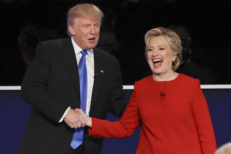 Republican presidential nominee Donald Trump and Democratic presidential nominee Hillary Clinton shake hands after the presidential debate Monday, Sept. 26, 2016, at Hofstra University in Hempstead, N.Y.