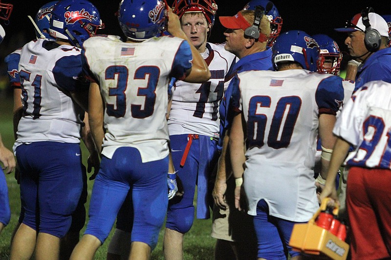 California assistant coach Jason Becker speaks to the defense during a timeout on Friday in Hallsville. 