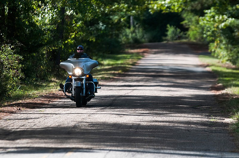 Staff Sgt. Benny Daffern with the Arkansas National Guard takes advantage of the cooler weather as he cruises down Airport Road. 