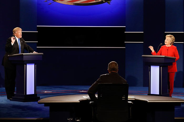 Presidential candidates Donald Trump and Hillary Clinton spar during a debate Monday at Hofstra University in New York.
