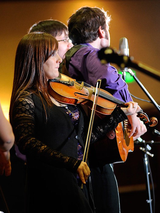 In this Jan. 9, 2015 file photo, Jeana Martin-Faris plays her fiddle alongside her siblings as the Bluegrass Martins perform in Jefferson City.