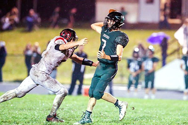North Callaway senior quarterback Milo Henry backpedals while throwing a pass in the Thunderbirds' 20-6 EMO victory against Clopton/Elsberry earlier this month in Kingdom City.