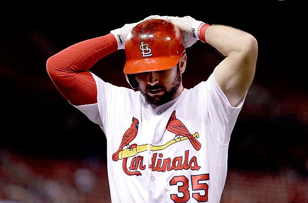 Greg Garcia of the Cardinals reacts after flying out during the ninth inning of Wednesday's game against the Reds in St. Louis. 