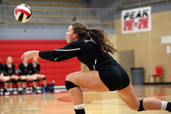 Maddi Stone of Jefferson City records a dig during Wednesday's match against Lebanon at Fleming Fieldhouse.