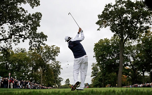Phil Mickelson hits a shot on the fourth hole during Wednesday's practice round for the Ryder Cup at Hazeltine National Golf Club in Chaska, Minn.