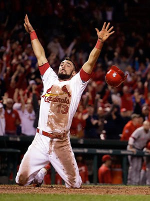 Matt Carpenter of the Cardinals celebrates after scoring on a walkoff double by Yadier Molina in the bottom of the ninth inning of Thursday night's game against the Reds at Busch Stadium.