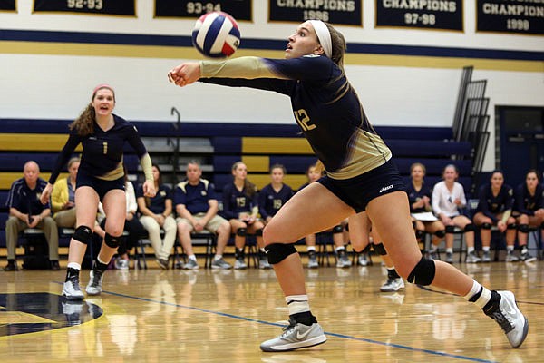 Ellie Rockers of Helias bumps the ball during Thursday night's volleyball match against Blair Oaks at Rackers Fieldhouse.