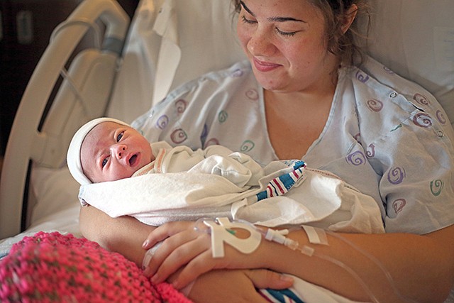 New mother Christina Roling holds her daughter Hallie Elizabeth Roling on Friday at St. Mary's Hospital. Hallie was the 101st baby at the hospital. Last year, the hospital averaged 1,013 babies born throughout the year, and last year 80 babies were born in September. "This has been the first time this year that this many babies in one month have been delivered," said Janet Wear-Enloe, director of business development and marketing at St. Mary's.