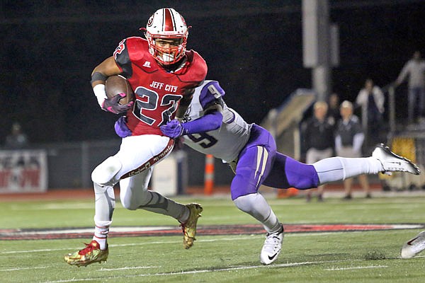 Jays running back Rashaun Woods is tackled by MJ Anderson during Jefferson City's game against C.B.C. on Friday at Adkins Stadium.