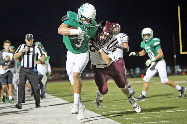Cody Alexander of Blair Oaks is tackled during the Falcons' game against School of the Osage on Friday at the Falcon Athletic Complex.
