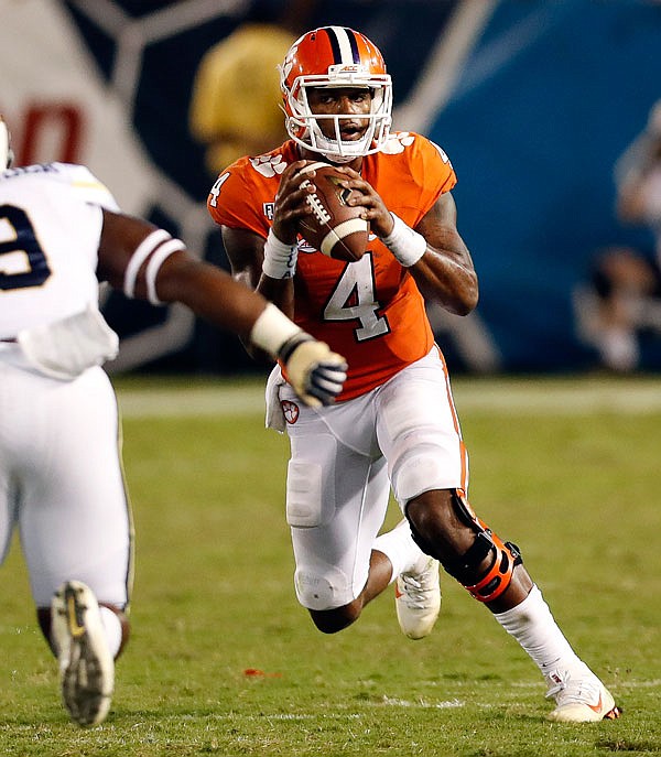AP
In this Sept. 22 file photo, Clemson quarterback Deshaun Watson looks to throw against Georgia Tech in the first half of Clemson's game in Atlanta. No. 3  Louisville can take a commanding lead in the ACC Atlantic race when it plays No. 5 Clemson today. Watson hopes to slow down Louisville quarteback Lamar Jackson's sprint toward the Heisman Trophy. 