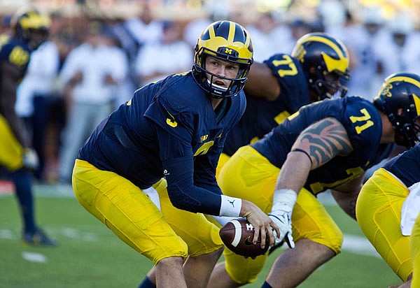 AP
In this Sept. 24 file photo, Michigan quarterback Wilton Speight takes a snap in the third quarter of an NCAA college football game against Penn State at Michigan Stadium in Ann Arbor, Mich. Quarterbacks Wilton Speight of Michigan and Alex Hornibrook of Wisconsin lead their unbeaten teams into a showdown at the Big House. 