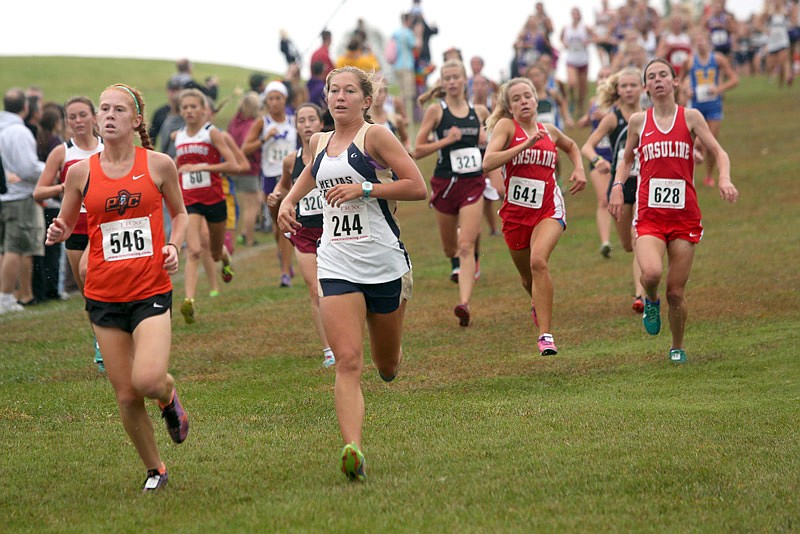 Kayla Yanskey (244) of Helias Catholic runs down the hill Saturday in the Capital City Challenge at the Oak Hills Golf Center in Jefferson City. 