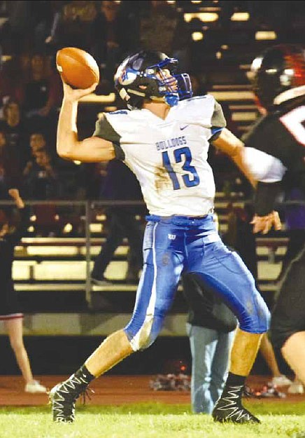 South Callaway junior quarterback Landon Horstman throws a pass during the Bulldogs' 69-0 EMO blitz of the Bobcats on Friday night, Sept. 30, 2016 in Bowling Green. Horstman threw for 166 yards and three touchdowns.