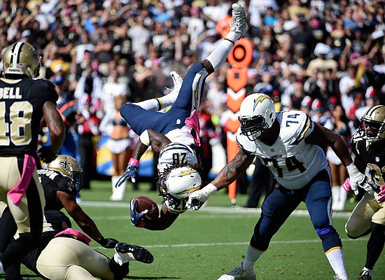 Chargers running back Melvin Gordon is flipped as he runs with the ball during the first half of Sunday's game against the Saints in San Diego.