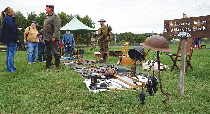 In this October 2, 2016 photo, German re-enactors show off World War I relics outside the Museum of Missouri Military History at the museum's second annual Military History Weekend. Around 2,000 people came to the event, which featured an open house at the museum, period re-enactors and free food.
