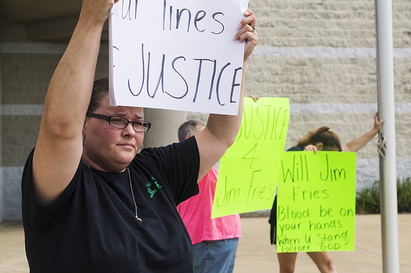 Sonya Steward protests Monday at the Miller County Sheriff's Office. Steward was a long-time friend of James Fries and believes the manslaughter charge is not sufficient for Tarah Fries, who allegedly stabbed James Fries after an argument.
