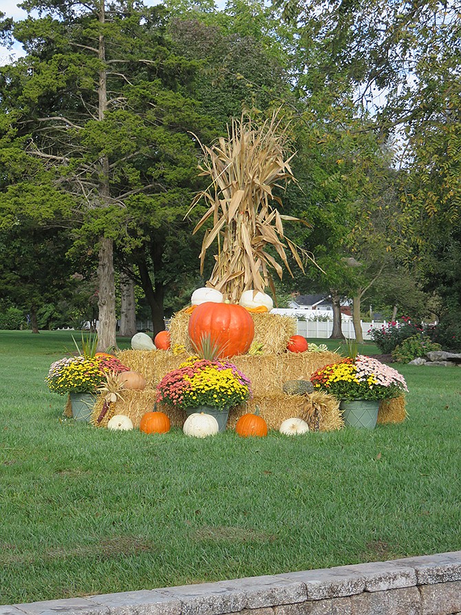 Outdoor fall decor is displayed by Clennin Farm Supply LLC.