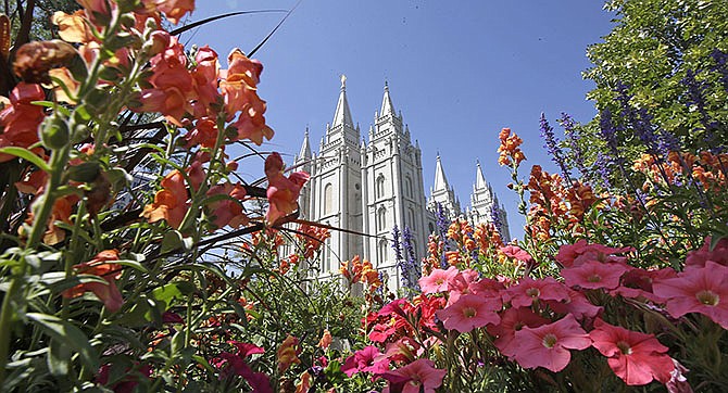 Flowers bloom in front of the Salt Lake Temple, at Temple Square, in Salt Lake City. In 15 videos posted online Sunday during the final day of the religion's twice-yearly conference, Mormon leaders discussed concerns about the growth of the gay rights movement and heard from a former U.S. senator and church member who tells them the Iraq war could open the door for new converts, according to the leaked footage.