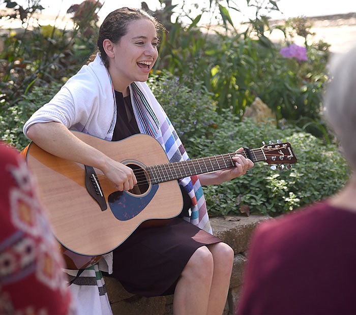 Rabbi-in-training Jennifer Maggin leads the Tashlich ceremony at the Noren River Access on Monday. Maggin has spent the past four years studying to be a rabbi.
