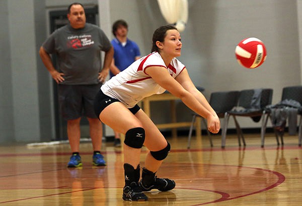 Kyra Wiegers of Calvary Lutheran bumps the ball during Tuesday night's match against Montgomery County at Calvary.
