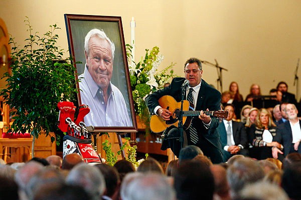 Country artist Vince Gill performs during Tuesday's memorial service for Arnold Palmer in the Basilica at Saint Vincent College in Latrobe, Pa.