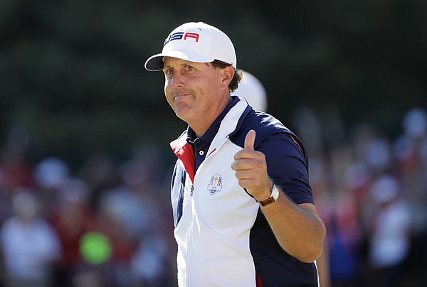 Phil Mickelson gives a thumbs up after winning the 15th hole during a singles match Sunday at the Ryder Cup at Hazeltine National Golf Club in Chaska, Minn.