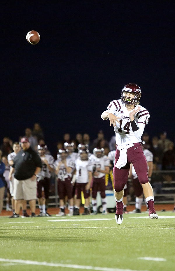 School of the Osage quarterback Zach Wheeler throws a pass downfield during last Friday night's game against Blair Oaks in Wardsville.