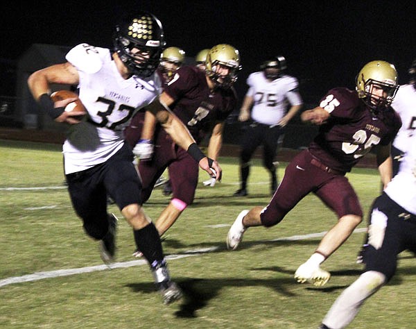 Versailles senior running back Shane Randall heads up field on a 10-yard reception during last Friday night's Tri-County Conference game at Eldon.