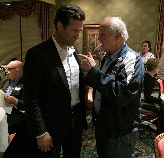 Russ Carnahan, left, meets Westminster College professor John Langton Friday night at the Meadow Lake Acres Country Club at New Bloomfield, Mo.