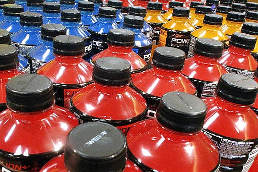 In this May 18, 2016 file photo, sodas and energy drinks are stacked and line the shelves in a grocery store in Springfield, Illinois.