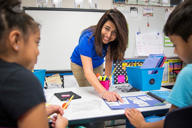 Bilingual teacher Olivia Mendez works with students in her second grade class at Shands Elementary on Thursday, Sept. 22, 2016, in Mesquite, Texas. The number of limited-English speakers in the state has grown by nearly 50 percent in the last decade with about 1 in 5 students struggling with the language. But in that same time, Texas had a dramatic 20 percent drop in the number of educators working in bilingual and ESL classes. 