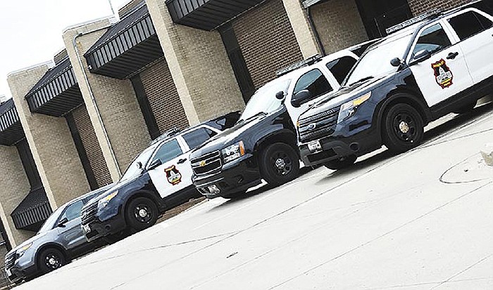 Patrol vehicles sit outside the Jefferson City Police station.