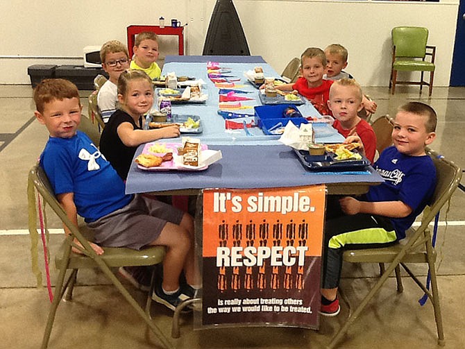 Russellville Elementary School kindergarteners and first-graders named as students of the month for October enjoyed a special lunch with a friend of their choice. Pictured are left side from front: Kannon Kruse, Lydia Sullivan, Braden Crafton and Ty Madole, and right side, from front: Luke Stillfield, Max Weber, Kaleb Calvird and Cainan Larison.