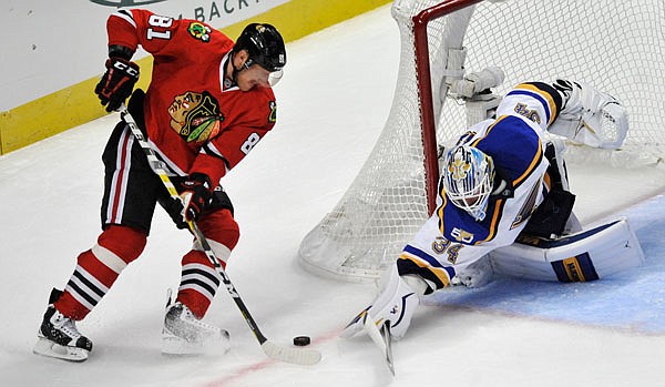 Blues goalie Jake Allen makes a save against Marian Hossa of the Blackhawks during the third period of Wednesday's game in Chicago.