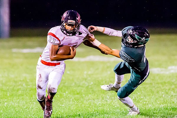 North Callaway cornerback AJ Stubblefield pulls down Clopton/Elsberry wide receiver Jamon Graham during the Thunderbirds' 20-6 EMO victory against the IndianHawks earlier this season in Kingdom City.