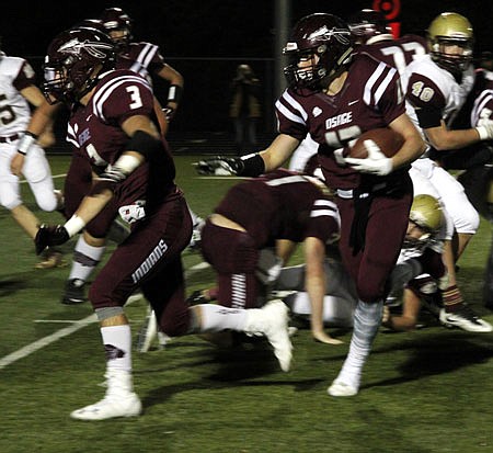 School of the Osage running back Nick Riley picks up yardage behind the blocking of Dylan Riley during last week's game against Eldon.