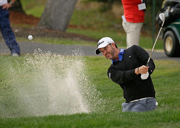 Scott Piercy hits the ball out of a bunker onto the third green of the Silverado Resort North Course during Thursday's first round of the Safeway Open in Napa, Calif. 