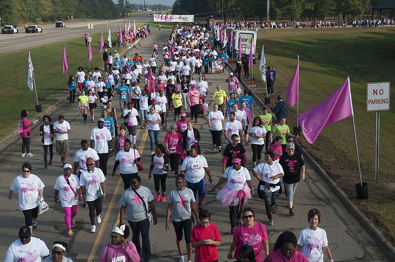 Participants in the 2016 Komen Texarkana Race for the Cure flood the raceway Saturday morning as they make their way out of the Four States Fairgrounds in Texarkana, Ark. 