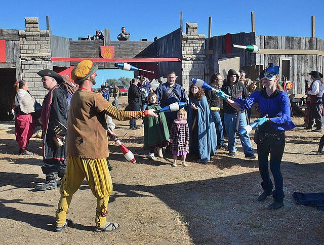 Jugglers show off their skills at the 2015 Renaissance Festival at Boster Castle in Callaway County.