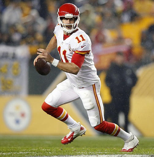 In this Oct. 2, 2016, file photo, Kansas City Chiefs quarterback Alex Smith (11) looks to pass during the first half of an NFL football game against the Pittsburgh Steelers, in Pittsburgh. The Oakland Raiders and Chiefs play Sunday, Oct. 16.