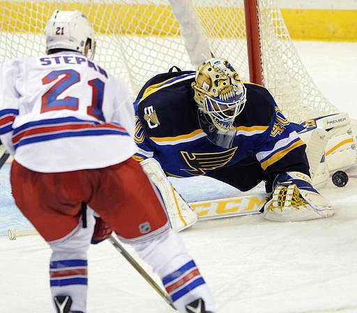 St. Louis Blues goalie Carter Hutton (40) blocks a shot by New York Rangers' Derek Stepan (21) during the third period of an NHL hockey game, Saturday, Oct. 15, 2016, in St. Louis. The Blues won 3-2.