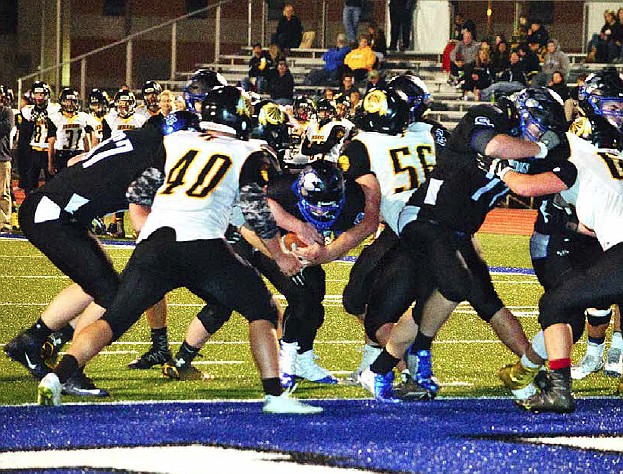 Shelly Sconce/Contributed
Junior running back Dalton Stone squeezes through a slight seam created by South Callaway's offensive line on a 1-yard touchdown run in the Bulldogs' 48-0 EMO triumph over Van-Far on Friday night, Oct. 14, 2016 in Mokane, Mo.