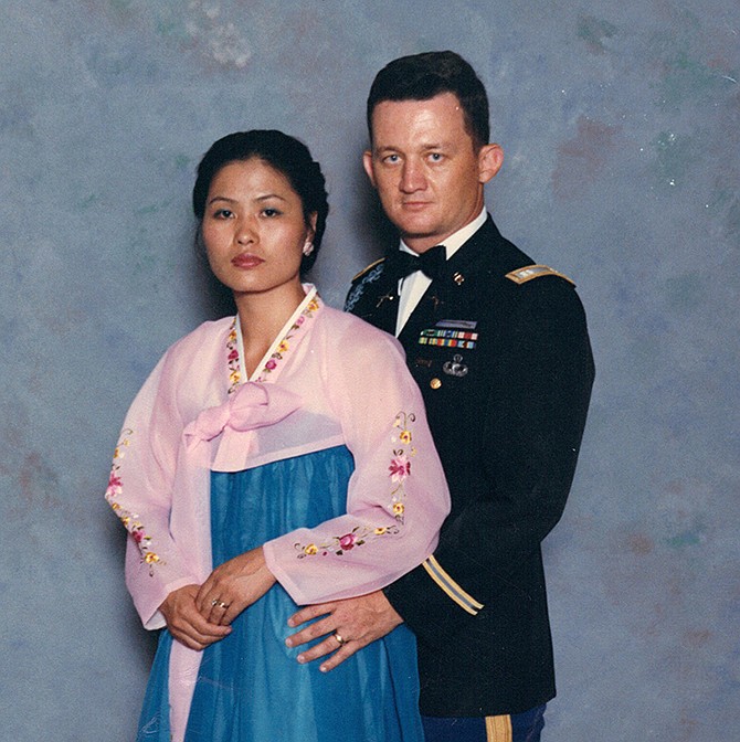 Retired Army Lt. Col. Stephen Tharp is pictured with his wife, Chang Sun, at a military social in 1988. Tharp has worked for the U.S. government for more than 40 years and has become an expert on U.S.-Korean affairs. 