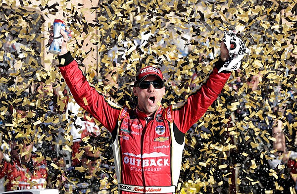 Kevin Harvick celebrates Sunday after winning the Sprint Cup Series race at Kansas Speedway in Kansas City, Kan.