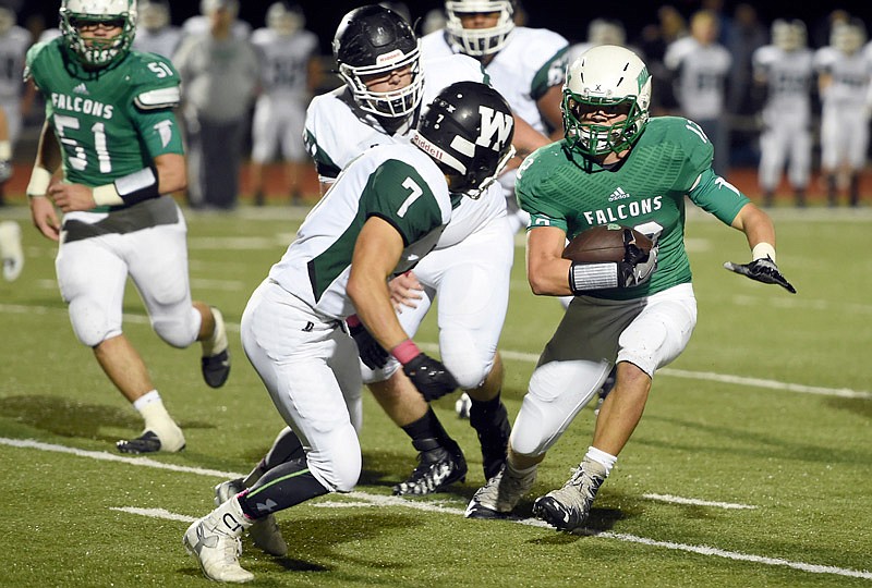 Blair Oaks Falcon Jared Lootens runs with the ball at the Blair Oaks High School versus Warsaw High School football game on Friday, Oct. 14, 2016.