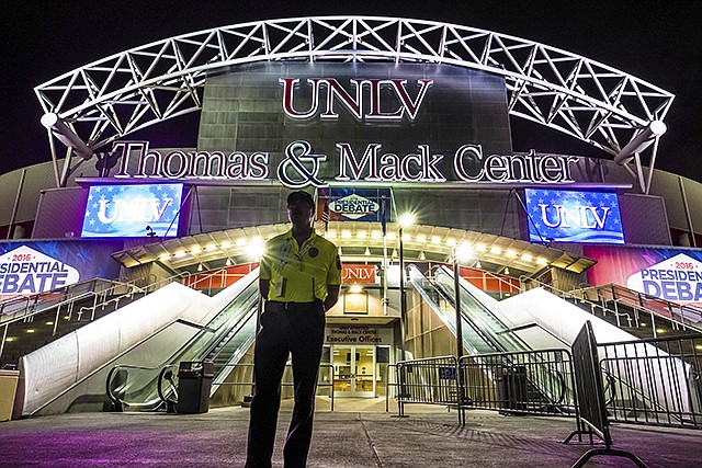 A member of the security team stands in front of the presidential debate site Sunday at the University of Nevada in Las Vegas. Democratic presidential nominee Hillary Clinton and Republican presidential nominee Donald Trump will meet in their third and final debate today.