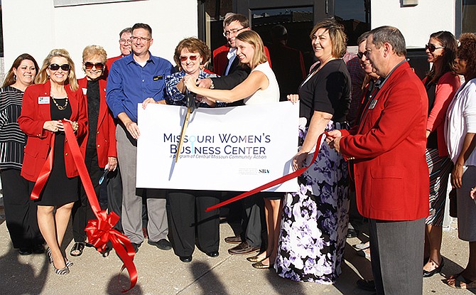 Local entrepreneurs and members of the Callaway Chamber of Commerce and Central Missouri Community Action gather to cut the ribbon for the Missouri Women's Business Center.